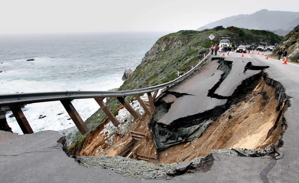 Coastal roadway collapsed into the sea after storm surge undermined the structure